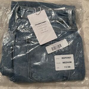 Risen high rise medium wash crop jeans with step hem